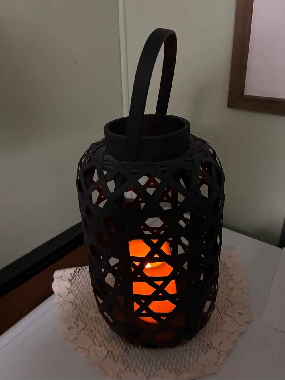 black woven bamboo lantern features an open lattice design that beautifully show